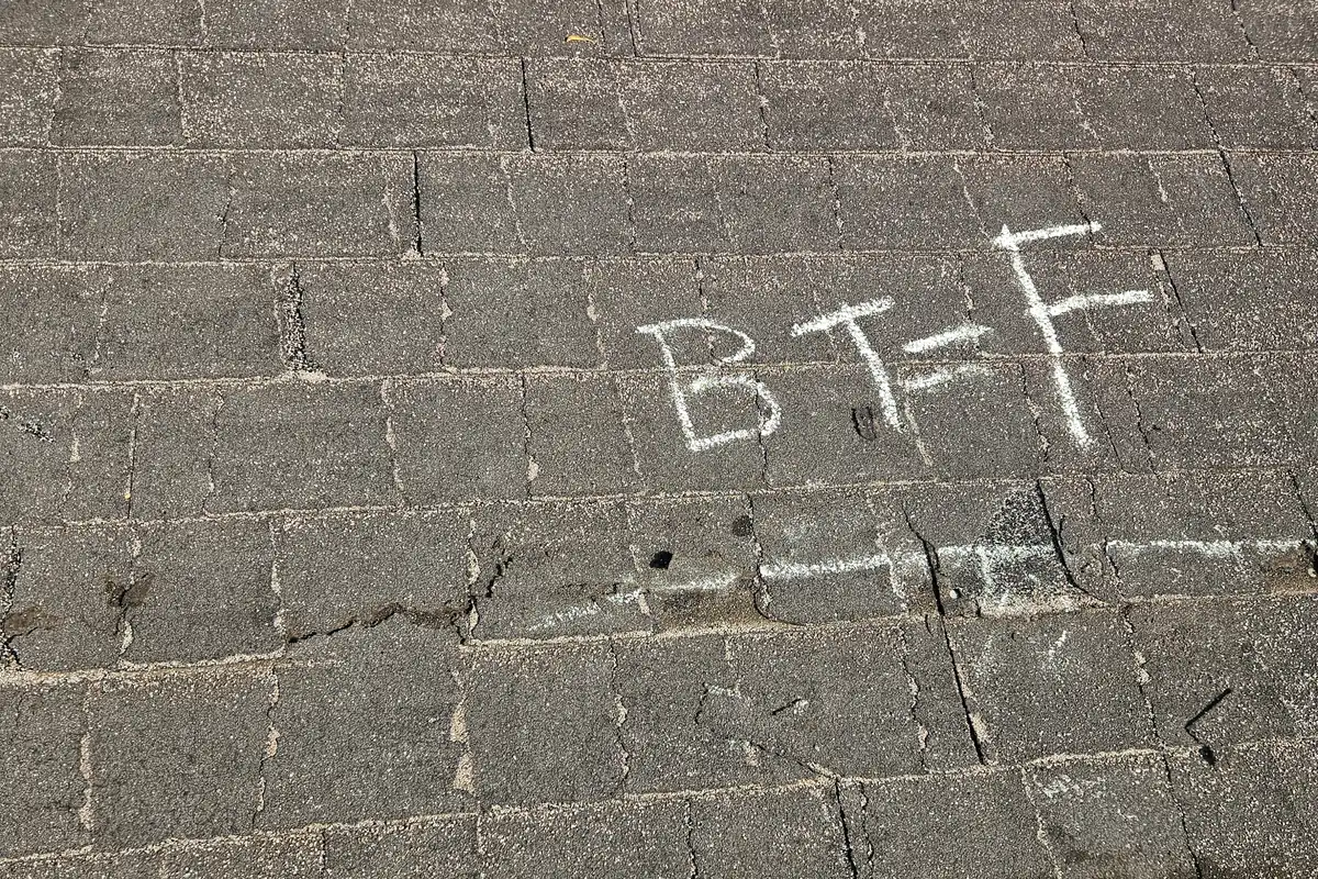 Asphalt shingles with chalk inspection marks.